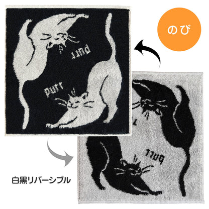 「のび」の見出しとともに、伸びをする猫柄の白黒リバーシブル面をそれぞれ矢印で示す図