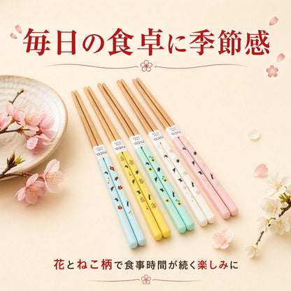 「毎日の食卓に季節感」の見出し。桜の枝を添え、水色・黄・ミント・白・桃5色の箸を並べて「花とねこ柄で食事時間が続く楽しみに」と訴求