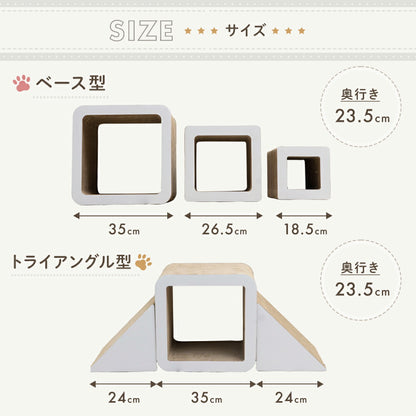 階段状に組んだキューブ型爪とぎの上に座る猫。「爪とぎ」「隠れ家」「遊び場」のラベルと、三角パーツで黒・白を選べるリバーシブル2タイプの紹介。