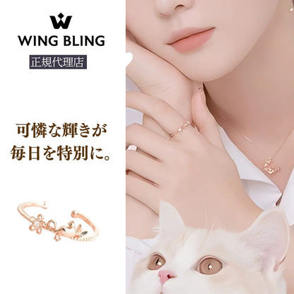 WING BLING正規代理店ロゴと「可憐な輝きが毎日を特別に。」のコピー。猫を抱く女性の手元にブルーミングキャットリングとネックレスを着けたイメージ写真、下部に花とリボンモチーフのリング単体カット