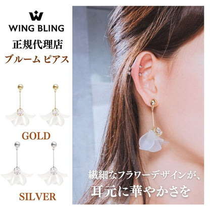 WING BLING正規代理店のブルーム ピアス紹介カット。左にゴールド・シルバー2色のドロップピアス一覧、右にレジン花びらを揺らして着用する女性の耳元。「繊細なフラワーデザインが、耳元に華やかさを」の文言