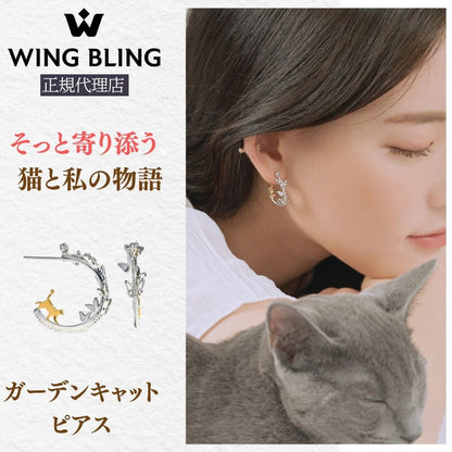 WING BLING正規代理店の見出しと「そっと寄り添う 猫と私の物語」のコピー、商品名「ガーデンキャットピアス」の表記。猫モチーフのフープピアス単体写真と、グレー猫を抱く女性の耳元の着用カット。